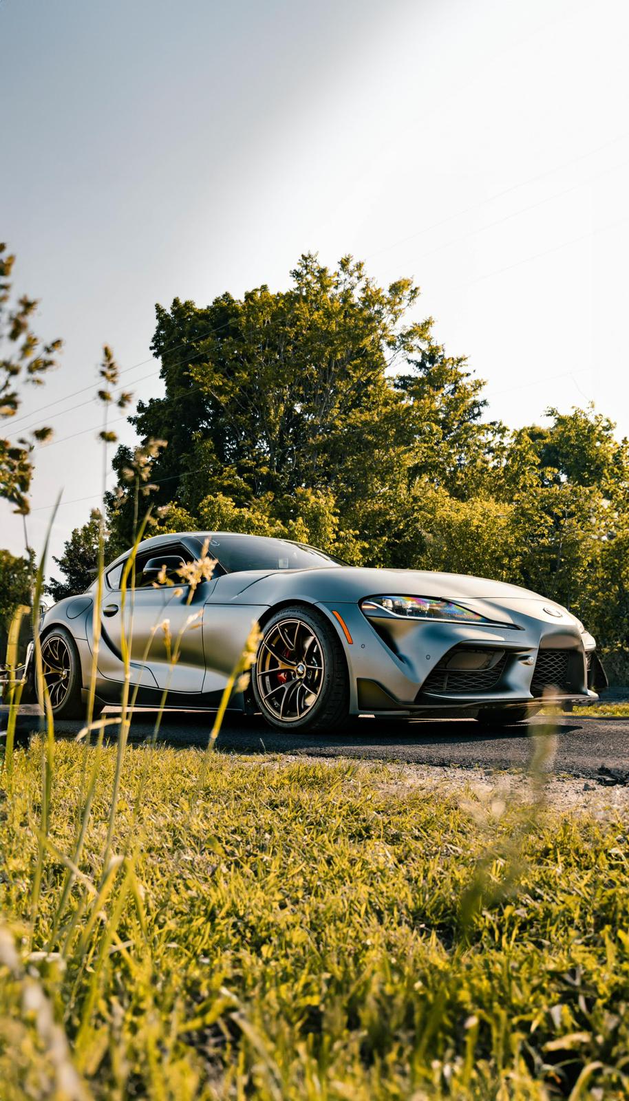 A GR Supra parked on the grass